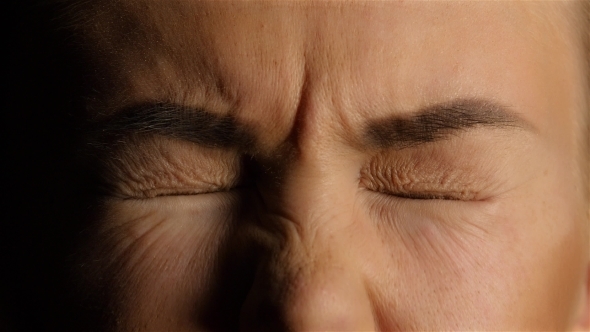 tightly closed eyes
